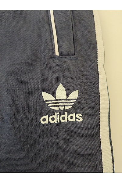ADIDAS Bavlněné tepláky s kapsami a lampasem Velikost L | ADIDAS | obrázek 3
